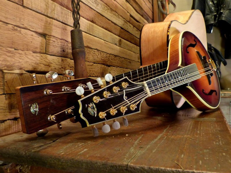 An old photo I took of my mandolin with the guitar Martin built for my dad
